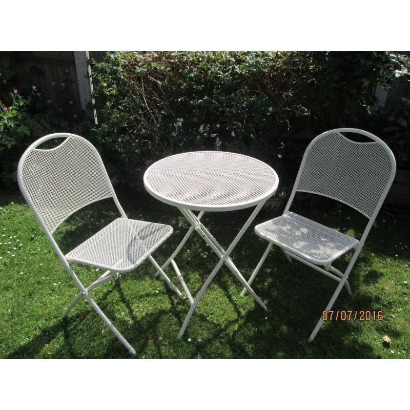 White metal round patio table and 2 chairs