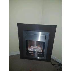 Electric fire place, brown surround and wall mountable