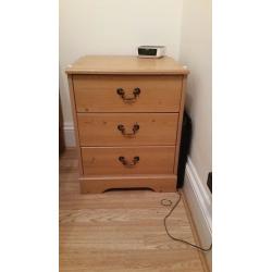 Two wooden bedside tables with drawers